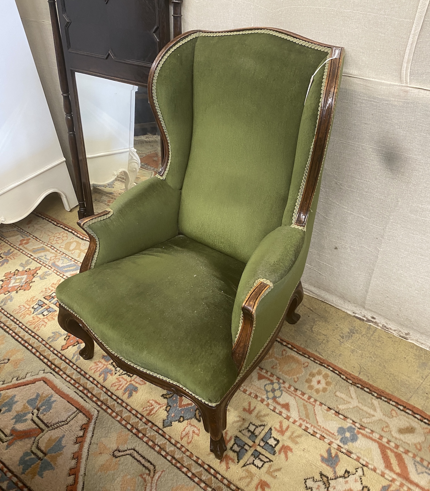A late Victorian upholstered mahogany armchair, width 66cm, depth 75cm, height 96cm